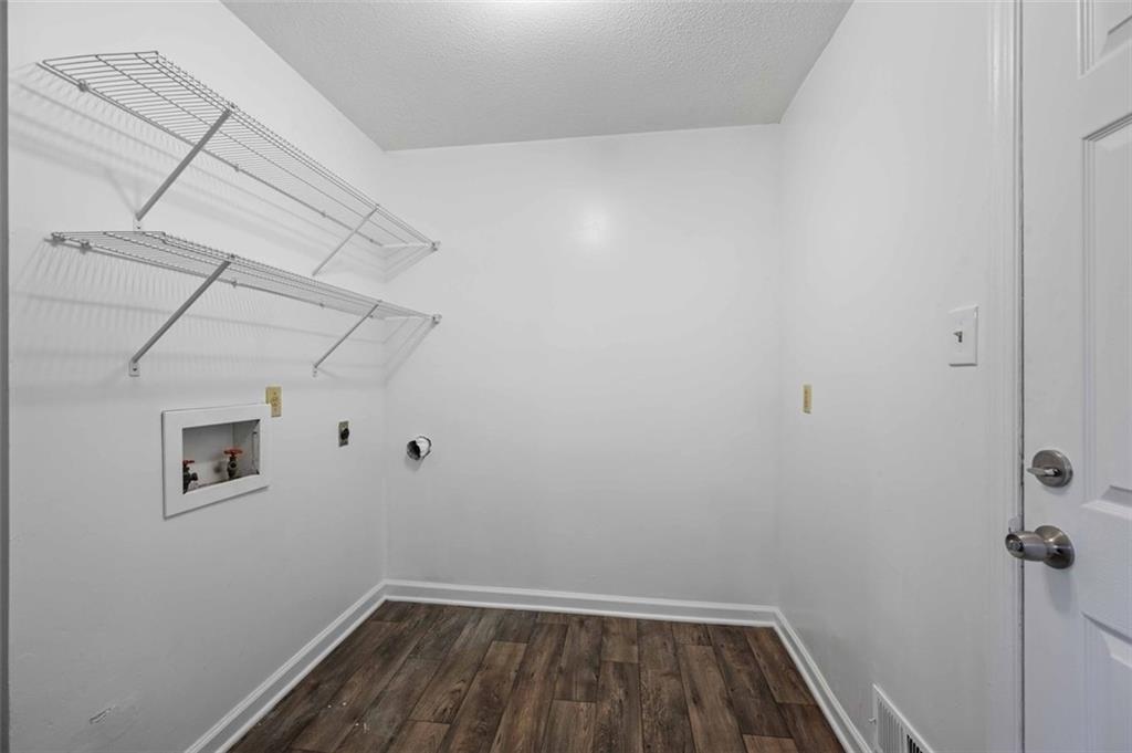 4166 Rue St Michel Stone Mountain, GA 30083 - Photo 19 of 31 a view of a room with racks on the wall