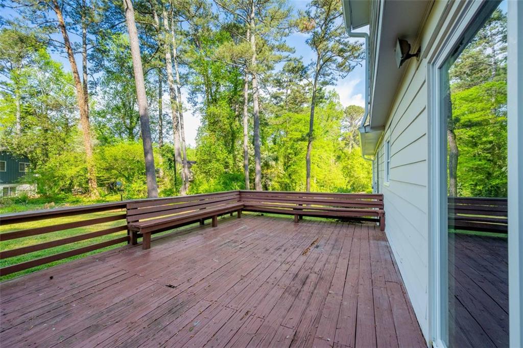 4166 Rue St Michel Stone Mountain, GA 30083 - Photo 28 of 31 a view of two chairs in the balcony with wooden floor