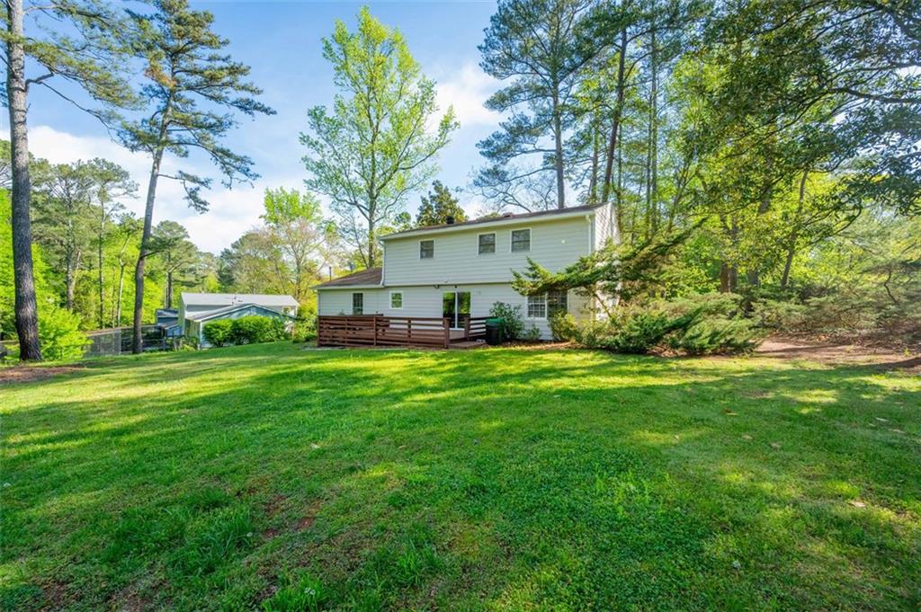 4166 Rue St Michel Stone Mountain, GA 30083 - Photo 30 of 31 a view of a house with a big yard