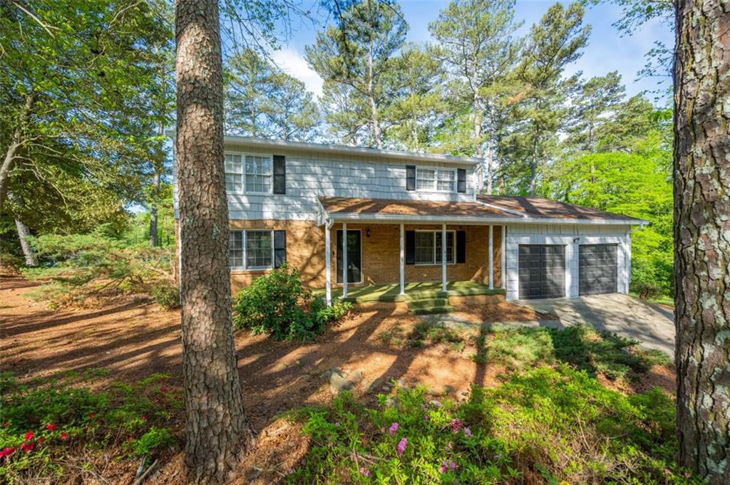 4166 Rue St Michel Stone Mountain, GA 30083 - Photo 3 of 31 front view of a house with a yard
