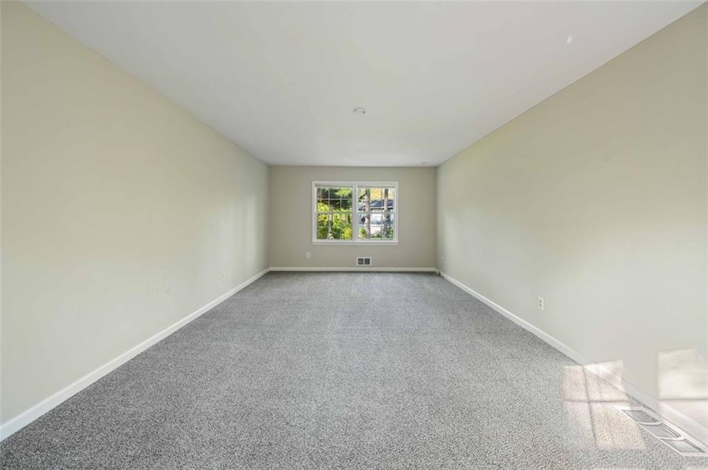 4166 Rue St Michel Stone Mountain, GA 30083 - Photo 7 of 31 an empty room with windows