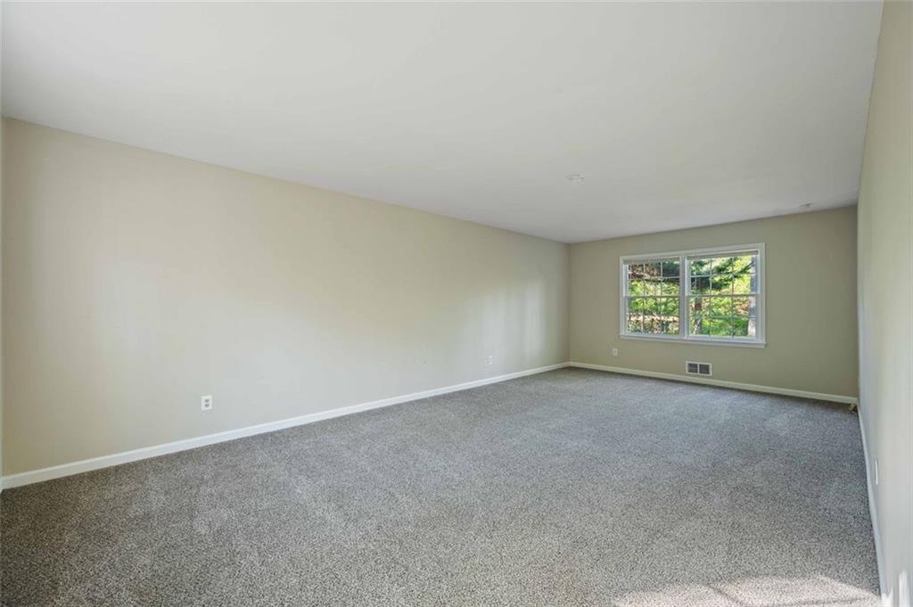 4166 Rue St Michel Stone Mountain, GA 30083 - Photo 9 of 31 an empty room with windows