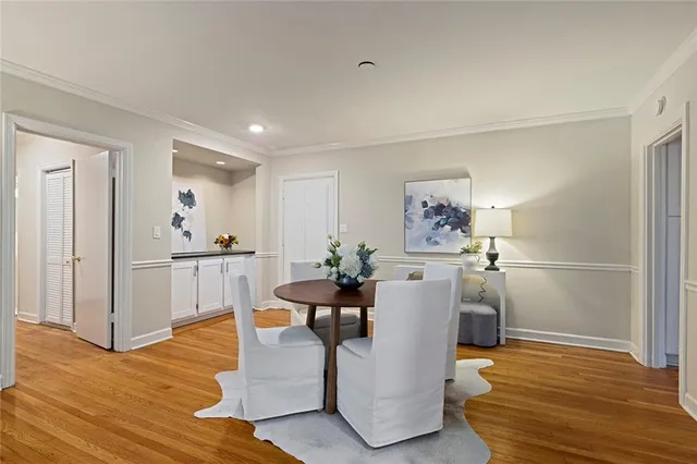a view of kitchen with furniture and wooden floor