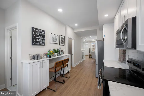 a view of a kitchen and dining room