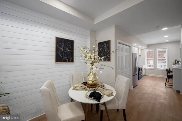 a dining room with furniture and window