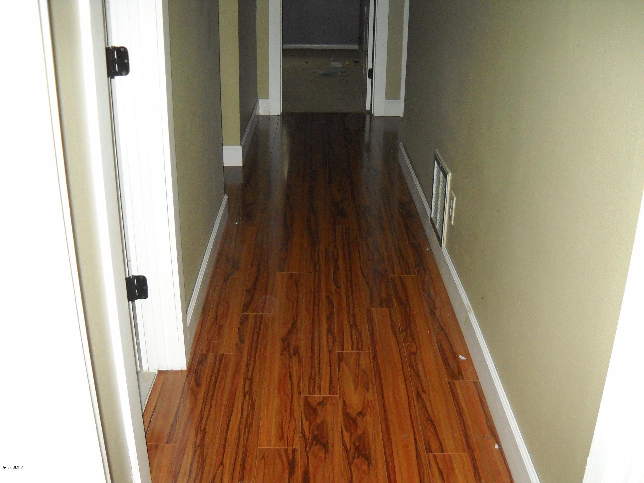 190 Sand Pine Road Indialantic, FL 32903 - Photo 11 of 21 Gorgeous wood flooring in hallway