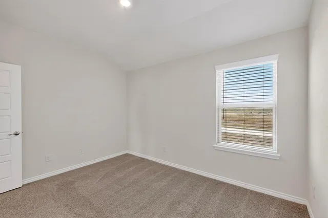 a bathroom with double sink and a mirror
