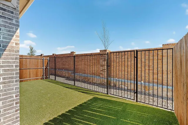 a view of backyard of a house