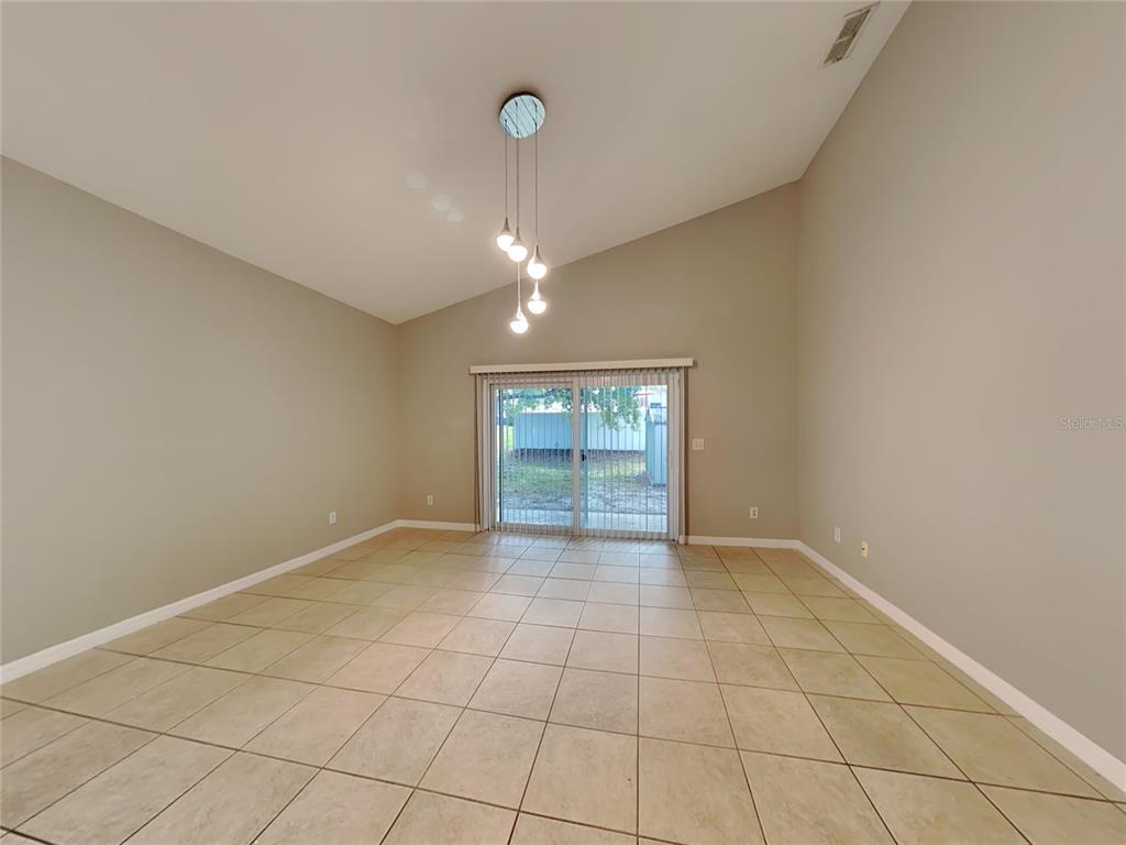 906 Summit Ash Court Deland, FL 32724 - Photo 5 of 19 a view of an empty room with a window