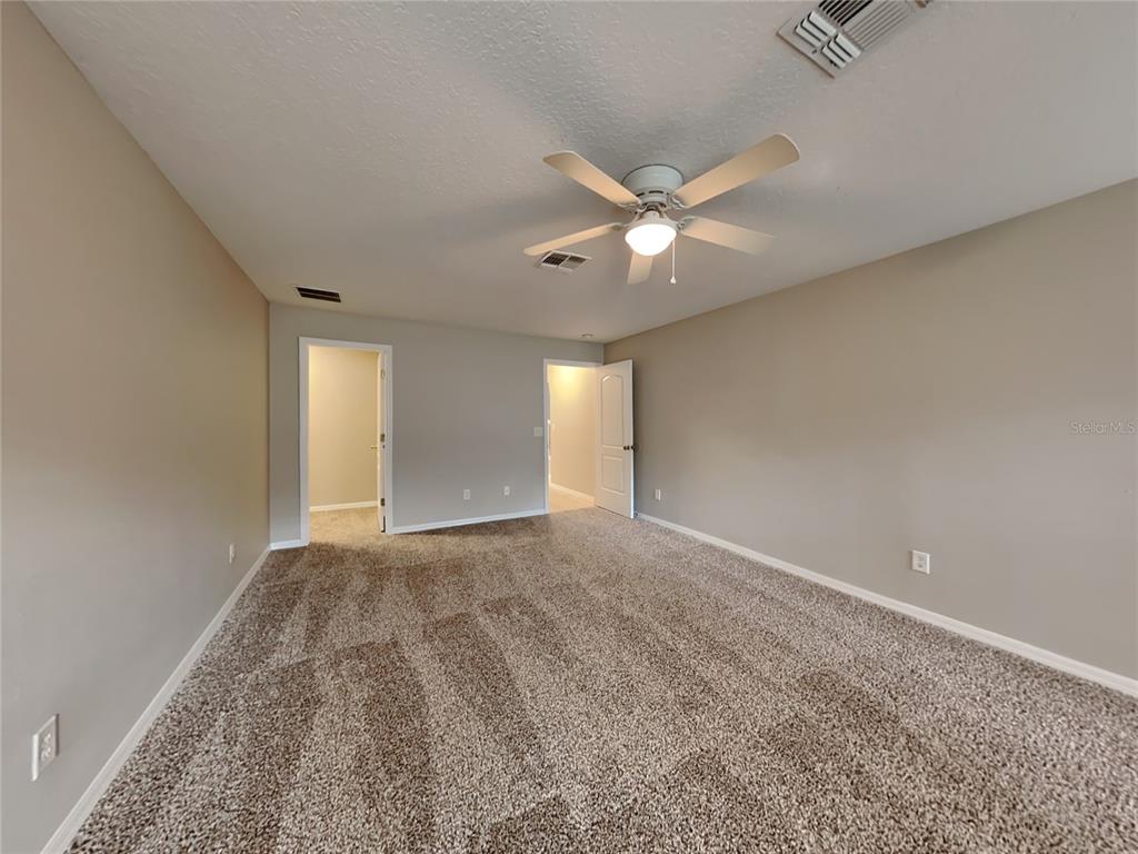 906 Summit Ash Court Deland, FL 32724 - Photo 8 of 19 a view of an empty room with a window