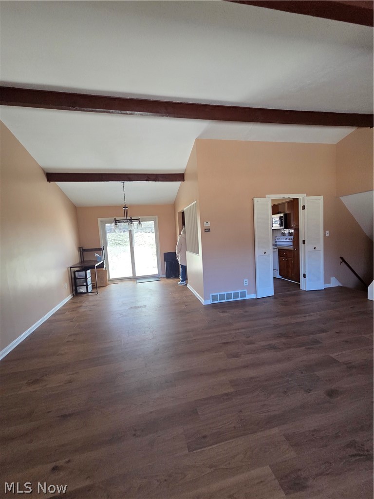 8137 State Road North Royalton, OH 44133 - Photo 12 of 41 Newer Laminate Flooring, Beamed Ceiling, and an entry coat closet