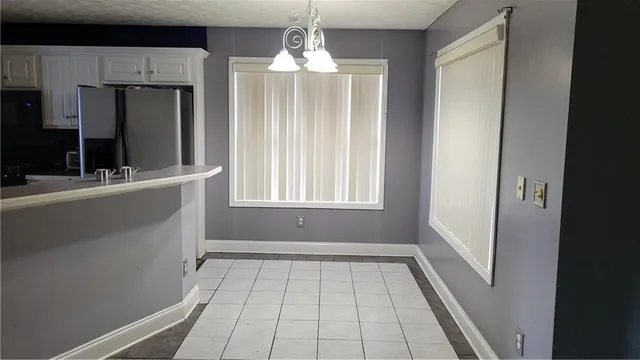 a view of a kitchen from the hallway