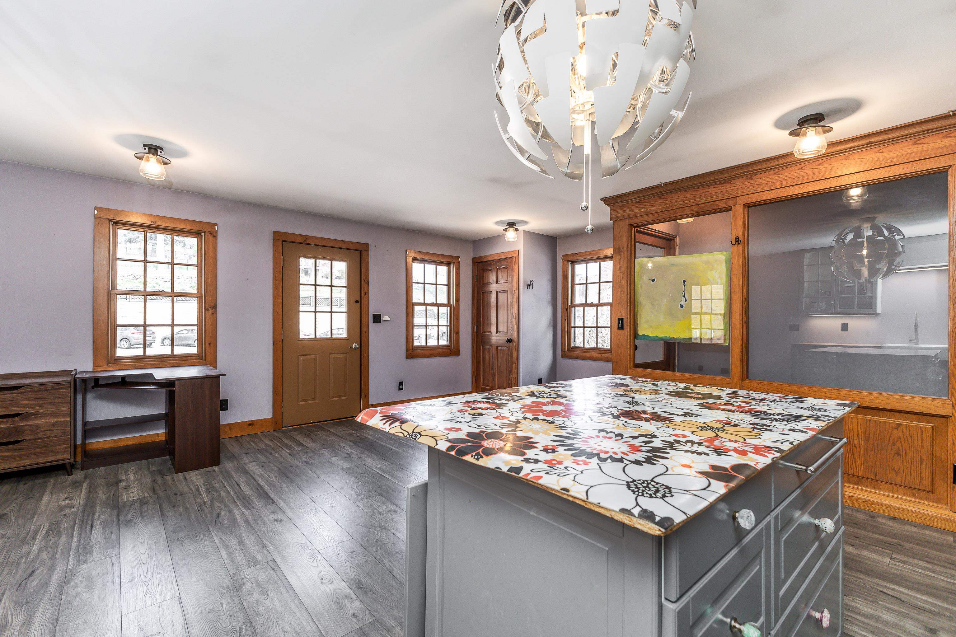 330 Spring Street Galena, IL 61036 - Photo 11 of 27 a kitchen with a kitchen island a stove and a wooden floors