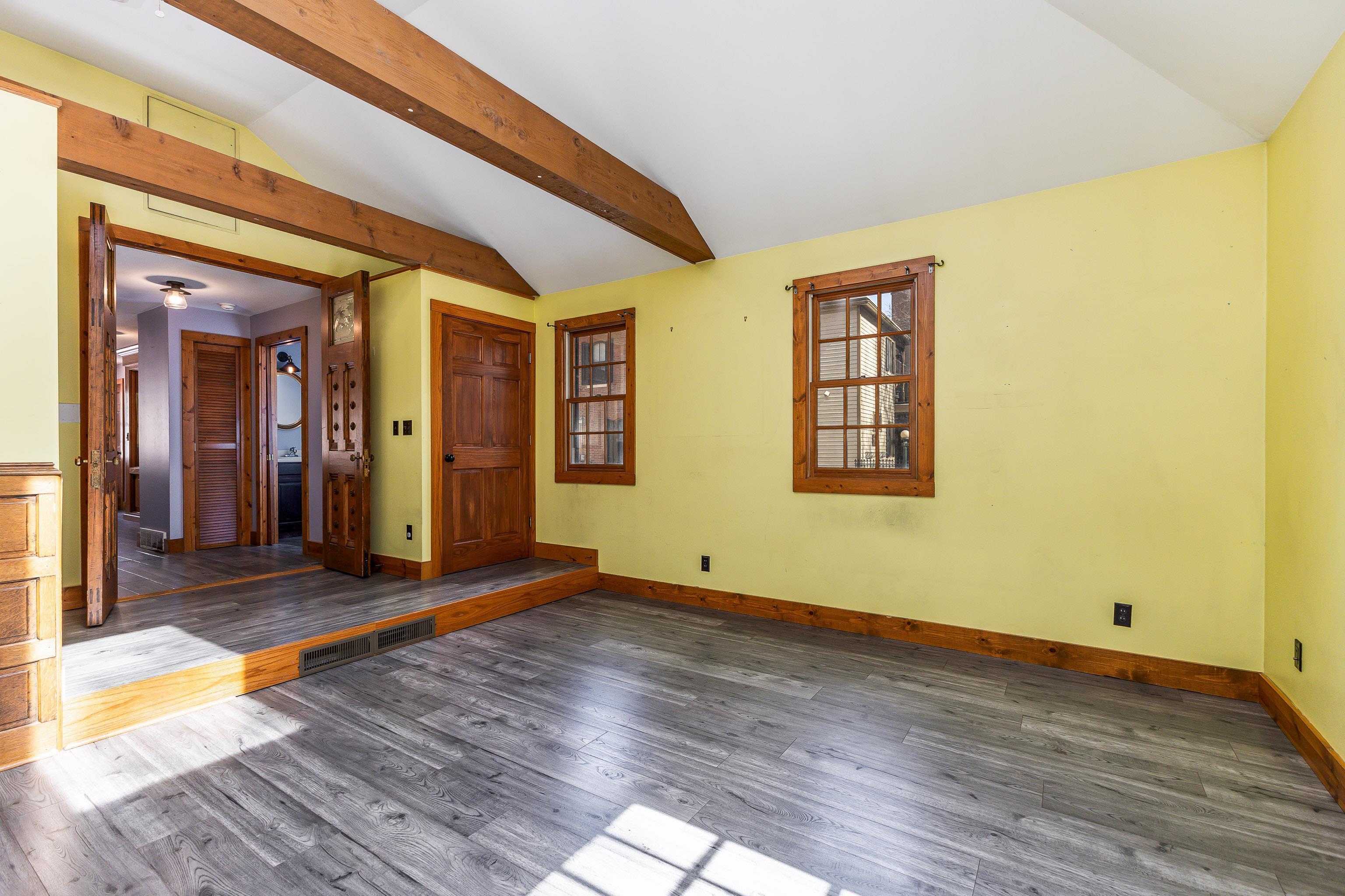 330 Spring Street Galena, IL 61036 - Photo 14 of 27 a view of an empty room with wooden floor and a window