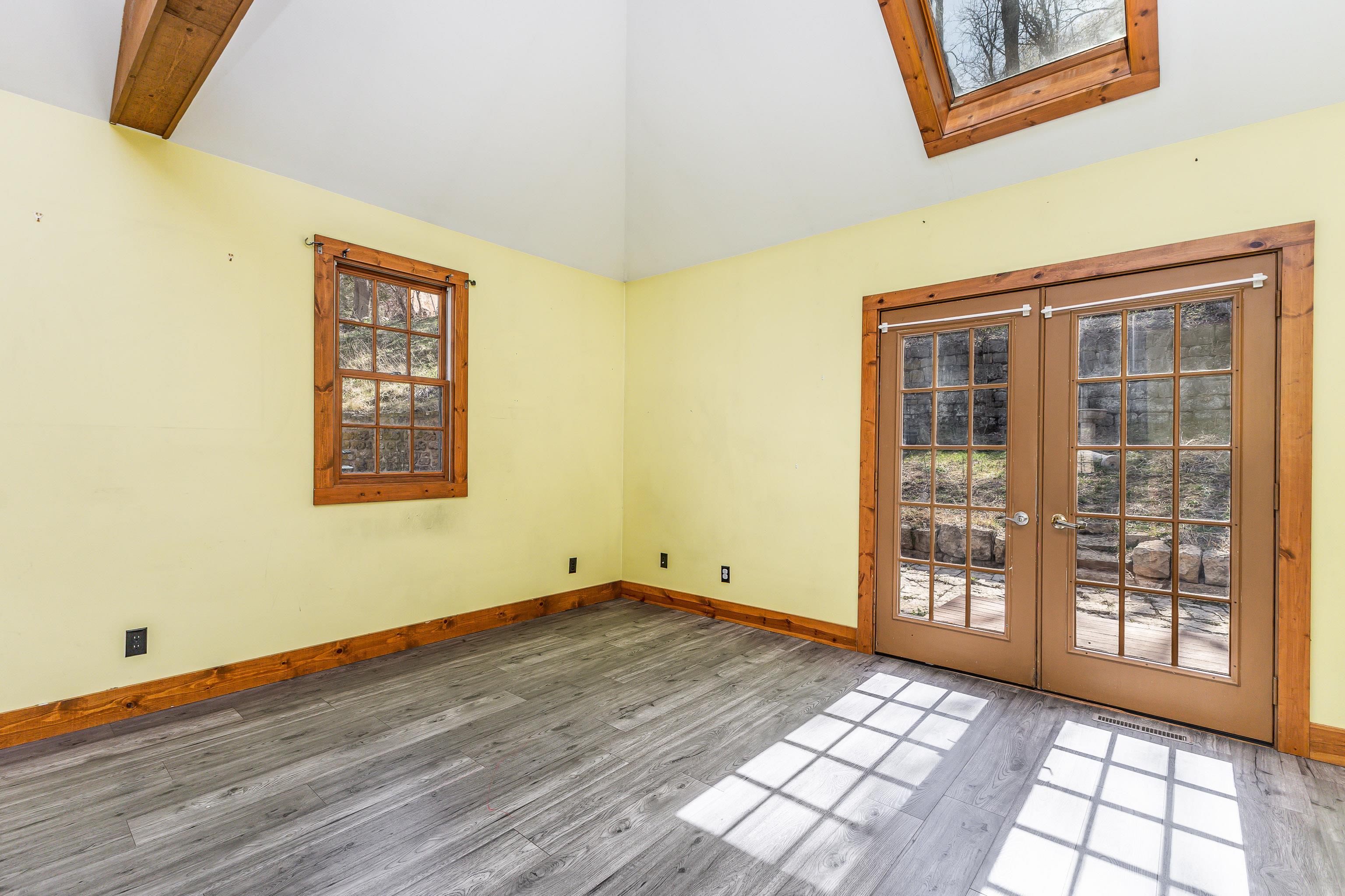 330 Spring Street Galena, IL 61036 - Photo 15 of 27 a view of an empty room with wooden floor and a window