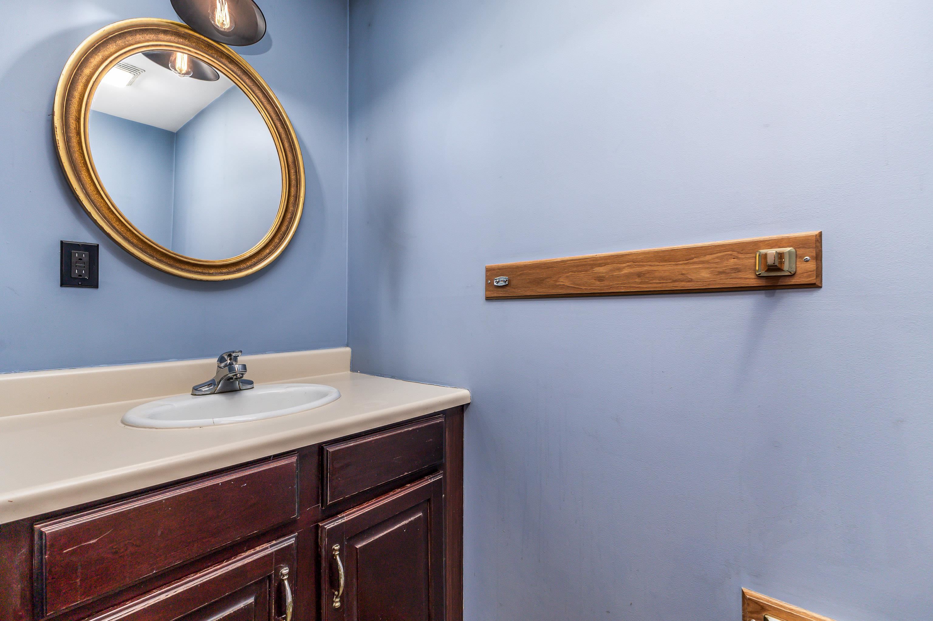 330 Spring Street Galena, IL 61036 - Photo 18 of 27 a bathroom with a sink and a mirror