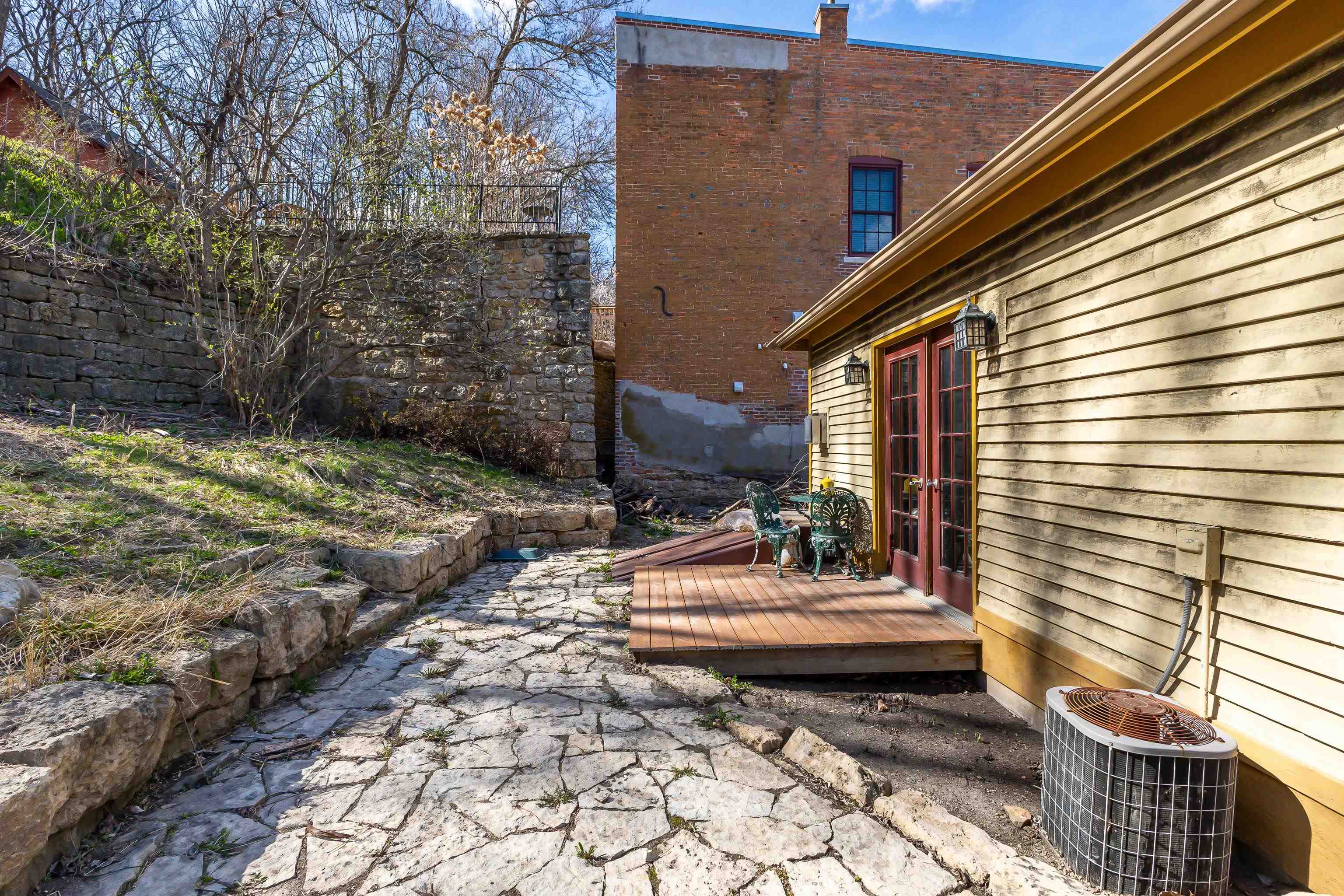 330 Spring Street Galena, IL 61036 - Photo 21 of 27 a view of a patio with table and chairs and wooden fence