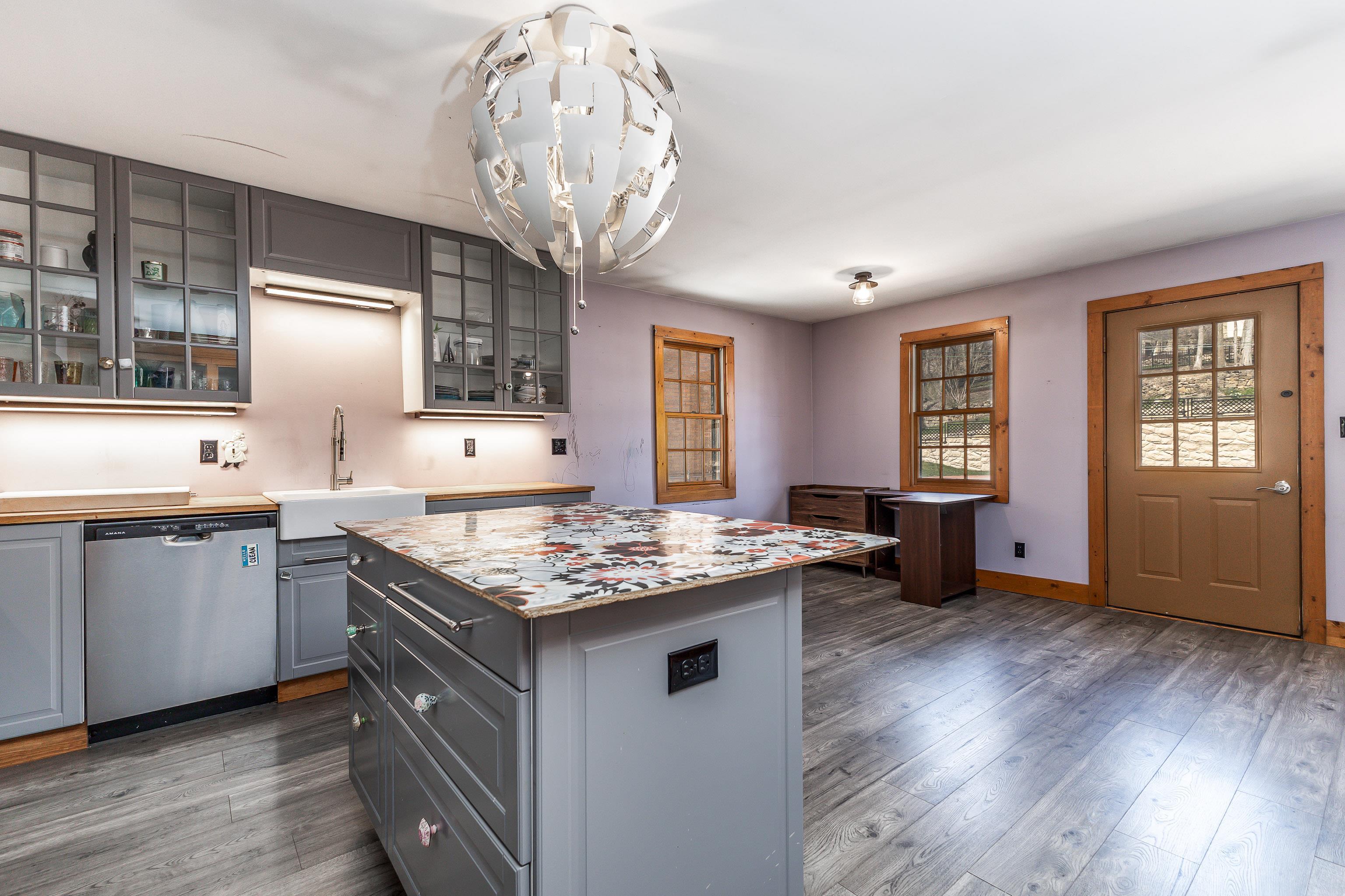 330 Spring Street Galena, IL 61036 - Photo 10 of 27 a kitchen with stainless steel appliances granite countertop a sink stove and refrigerator