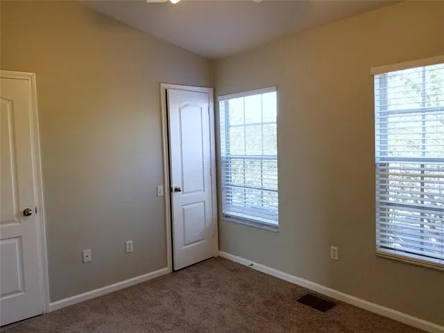 an empty room with closet area