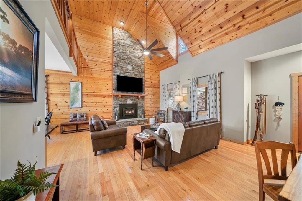 411 Gunite Circle Ellijay, GA 30540 - Photo 11 of 81 a living room with furniture and a flat screen tv