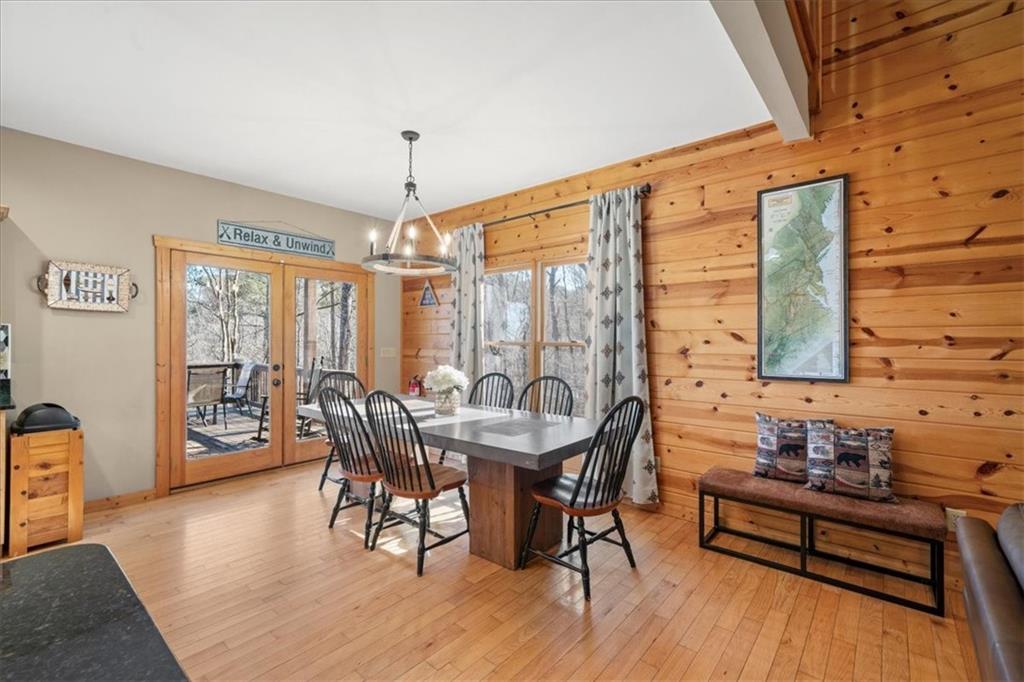 411 Gunite Circle Ellijay, GA 30540 - Photo 24 of 81 a dining room with furniture window wooden floor