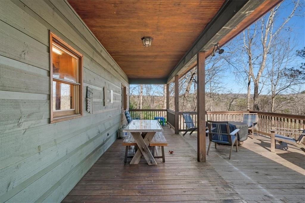 411 Gunite Circle Ellijay, GA 30540 - Photo 33 of 81 a balcony with chairs and wooden floor