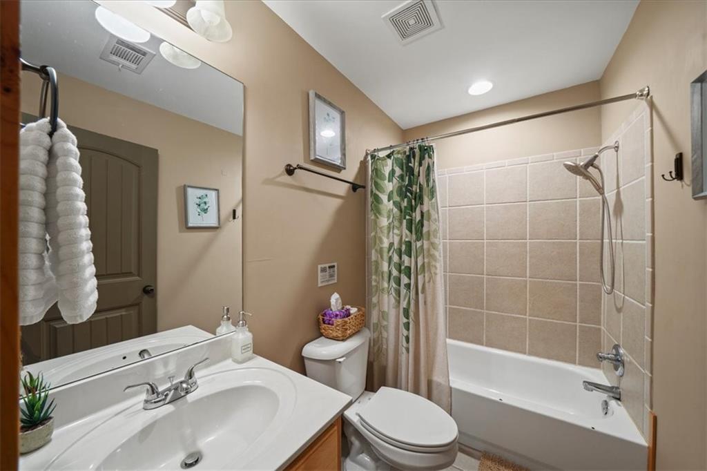 411 Gunite Circle Ellijay, GA 30540 - Photo 40 of 81 a bathroom with a sink toilet and shower