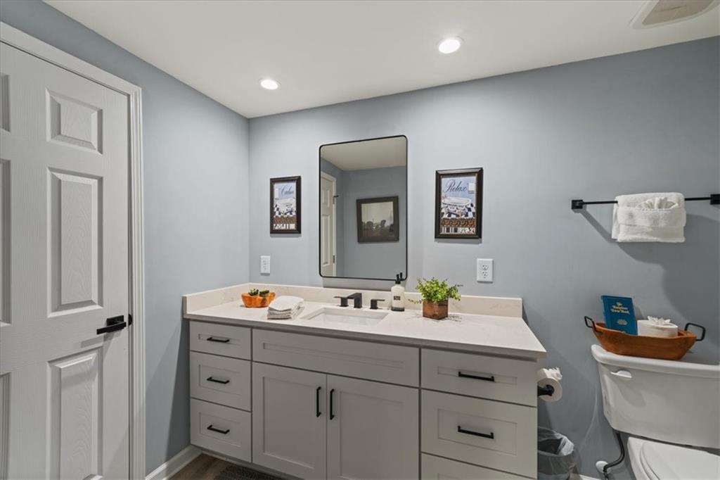411 Gunite Circle Ellijay, GA 30540 - Photo 47 of 81 a bathroom with a sink double vanity and a mirror