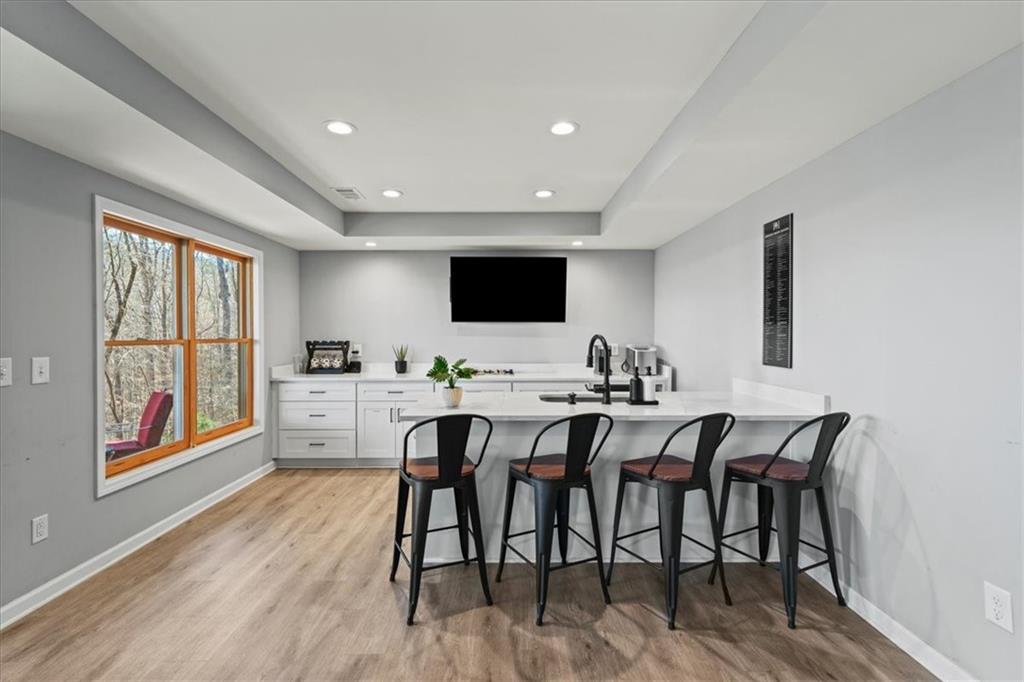 411 Gunite Circle Ellijay, GA 30540 - Photo 48 of 81 a view of a dining room with furniture and wooden floor