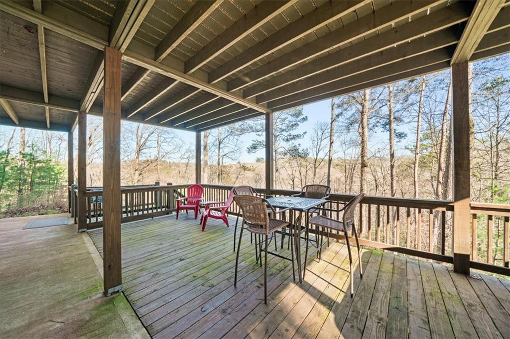 411 Gunite Circle Ellijay, GA 30540 - Photo 58 of 81 a view of a deck with wooden floor and outdoor seating