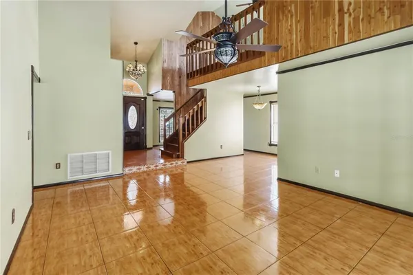 a view of a hallway with entryway wooden floor and front door