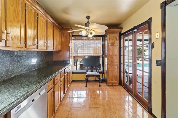 a view of a living room and kitchen with a large window