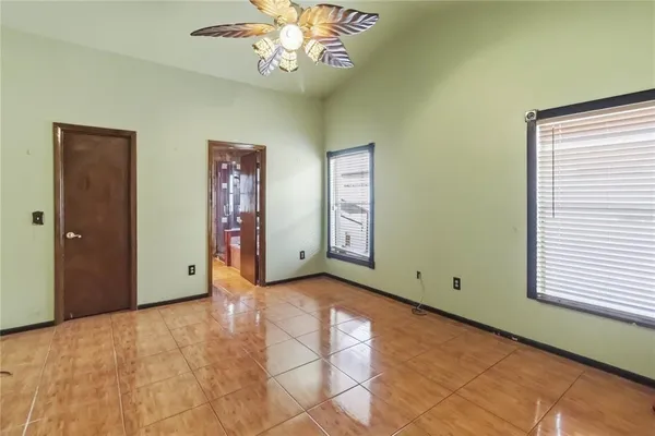 a view of an empty room with a window