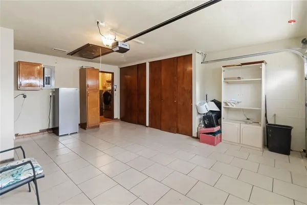 a view of a livingroom with furniture and a ceiling fan