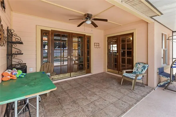 a view of an chairs and table in kitchen room