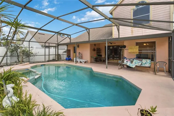 a view of a swimming pool with a patio