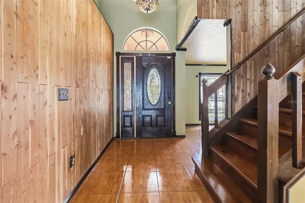 a view of a hallway with wooden floor and a hallway