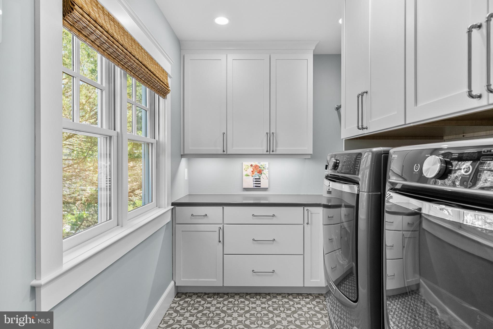 7989 East Riverside Drive Pasadena, MD 21122 - Photo 32 of 44 Laundry Room with Built-Ins & Tile