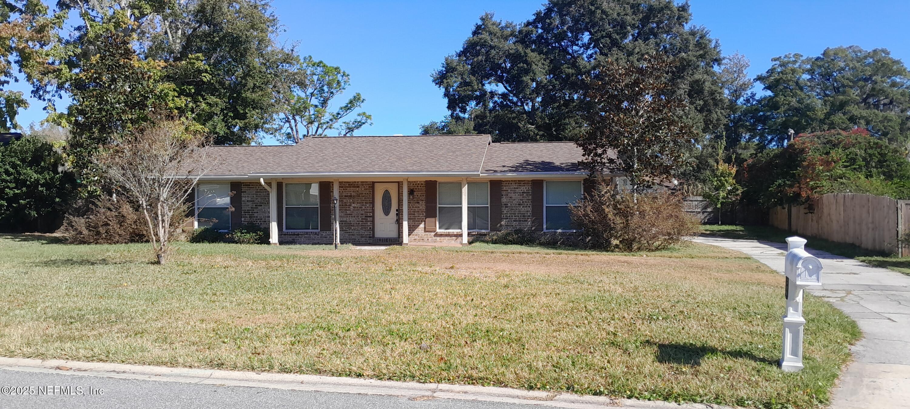 2724 Lexington Drive Orange Park, FL 32073 - Photo 1 of 11 a front view of a house with a yard
