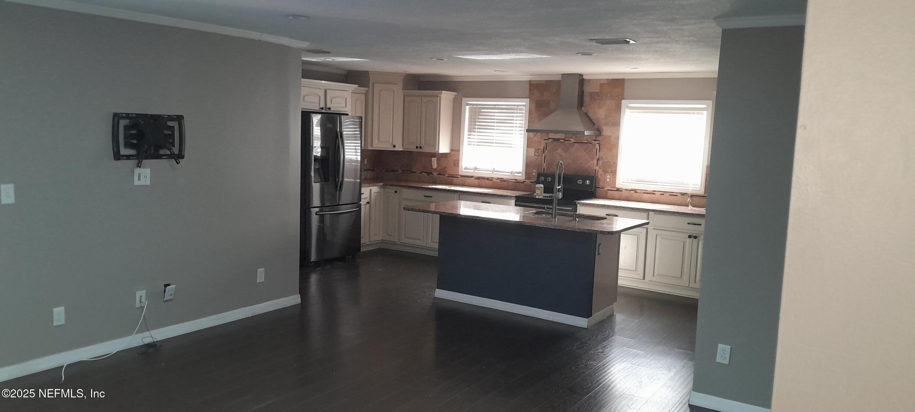 2724 Lexington Drive Orange Park, FL 32073 - Photo 4 of 11 a kitchen with stainless steel appliances granite countertop a sink and a refrigerator