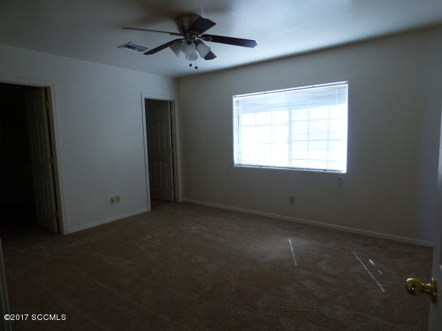 1024 Paseo Lobo Rio Rico, AZ 85648 - Photo 6 of 12 a view of an empty room with a window
