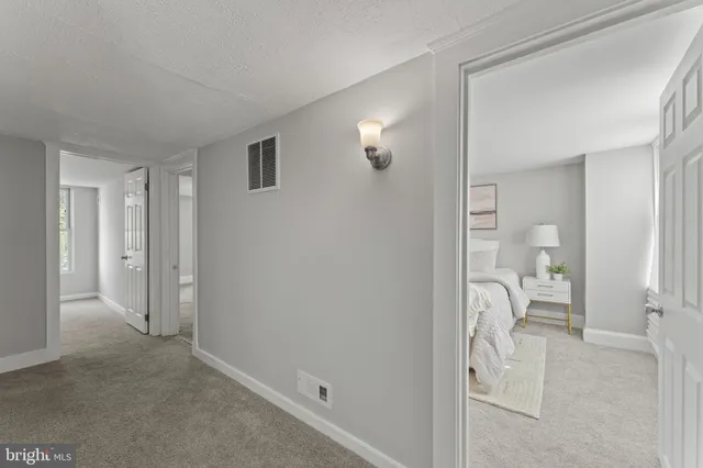 a view of a livingroom and a livingroom with furniture