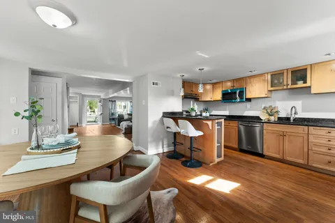 a kitchen with a table and chairs in it