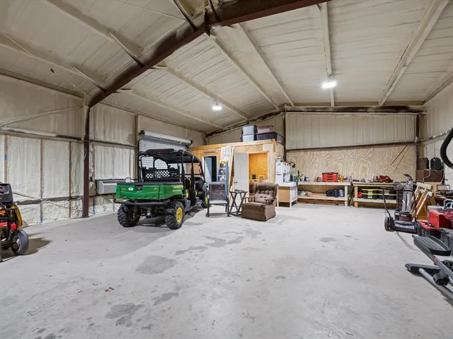 a view of a garage with parked cars