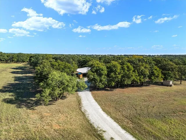 a view of a pathway both side of building and yard