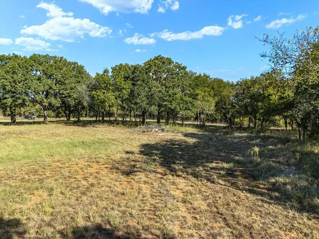 a view of a street with an outdoor space