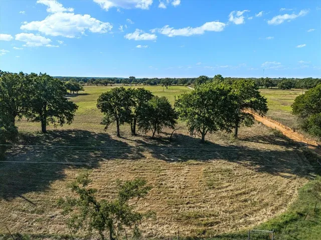 a view of a lake with a yard