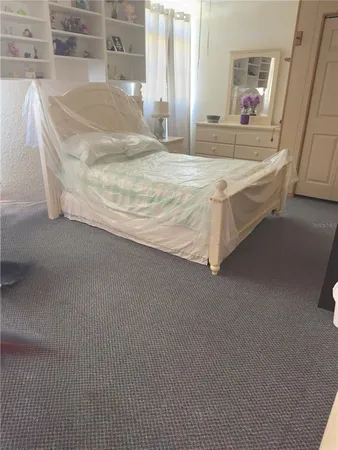 a en suite bathroom with a granite countertop sink