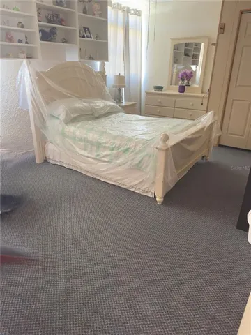 a en suite bathroom with a granite countertop sink