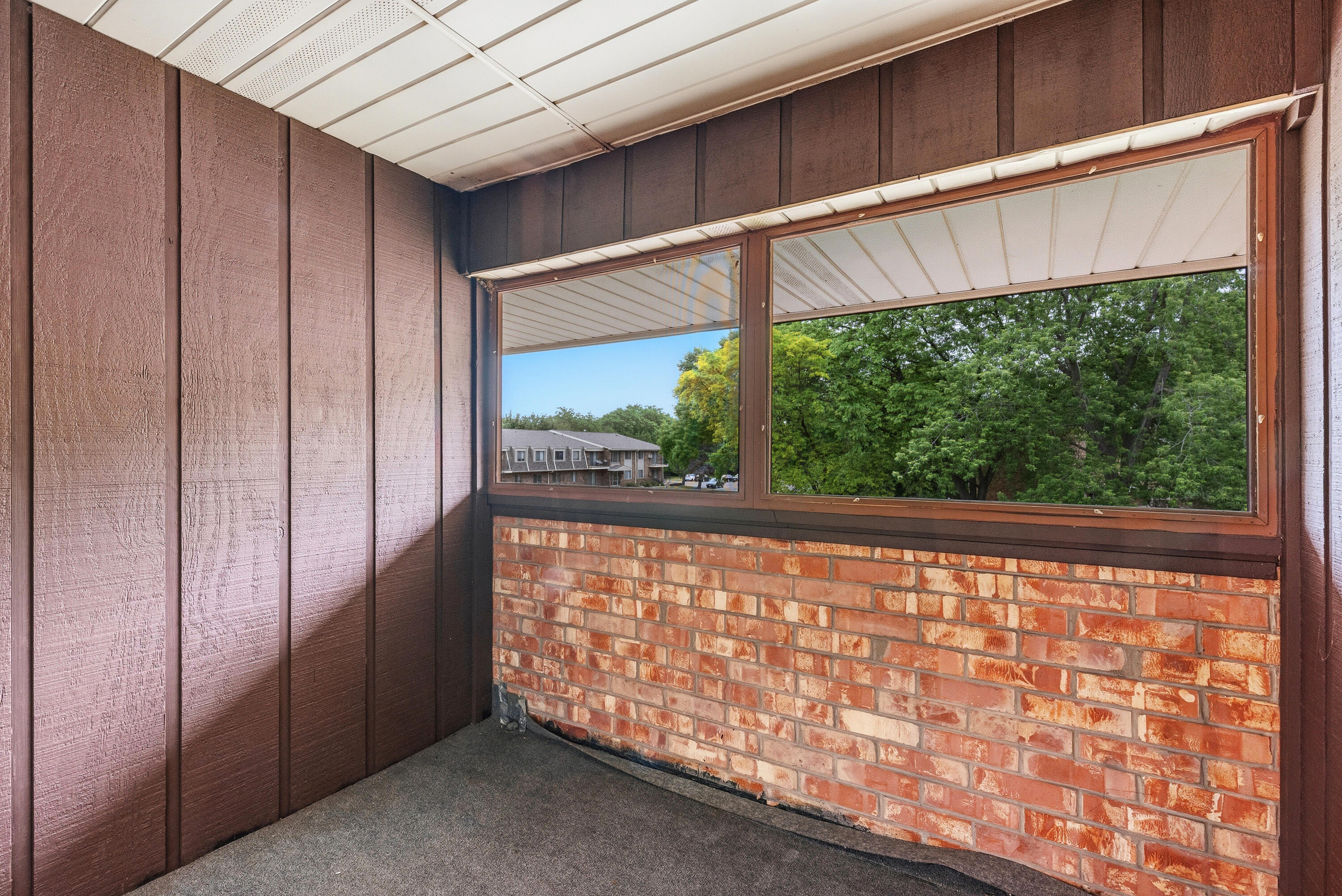 4155 West Rivers Edge Circle, Unit 4 Brown Deer, WI 53209 - Photo 7 of 18 3-season balcony. Enjoy your coffee and listen to the birds.